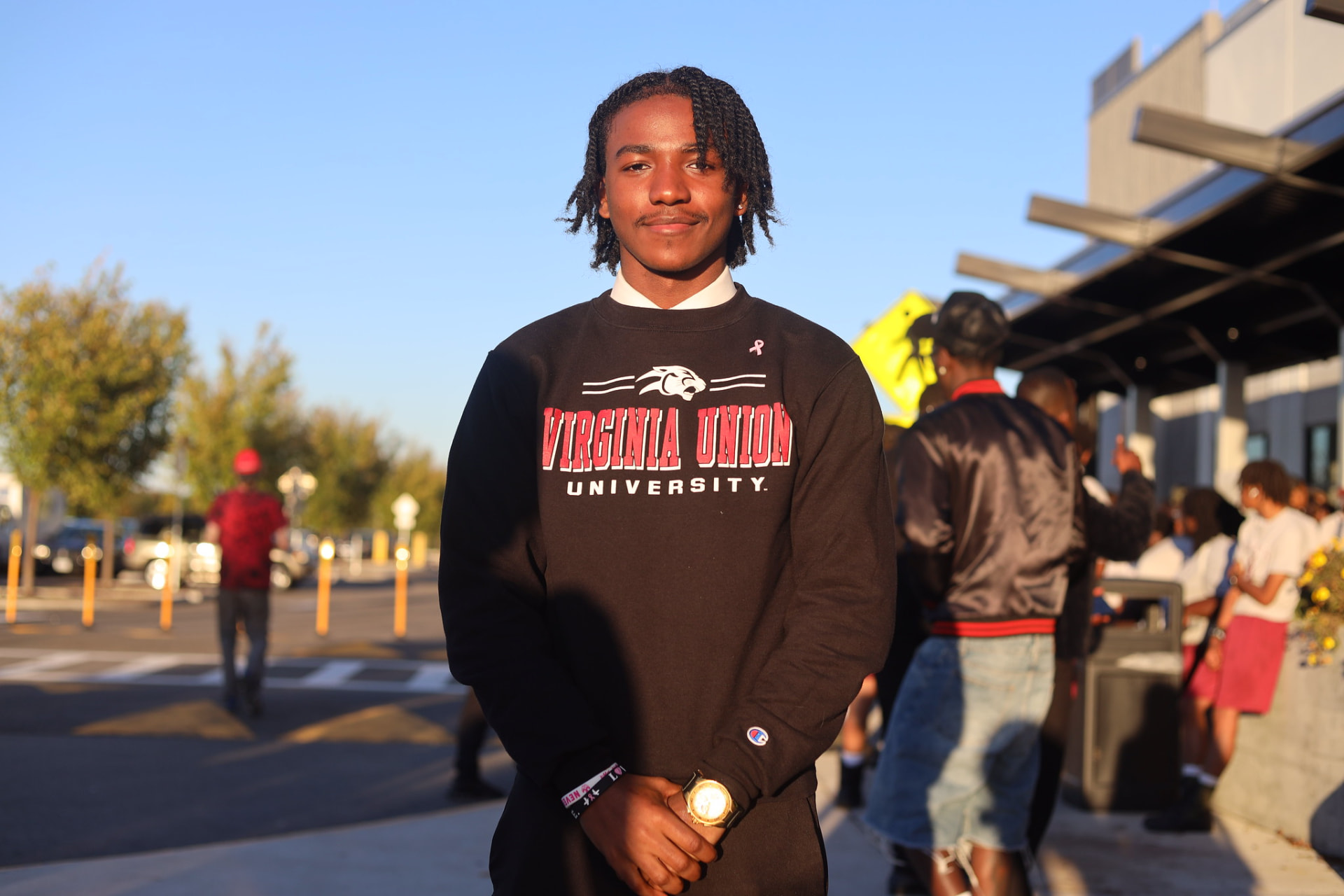 Student in a Virginia Union University crewneck on campus