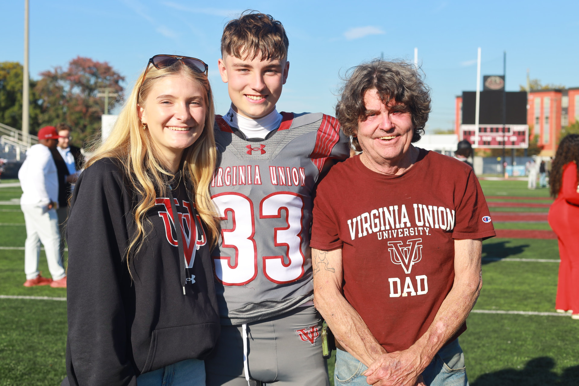 Panthers family on the field before the homecoming game