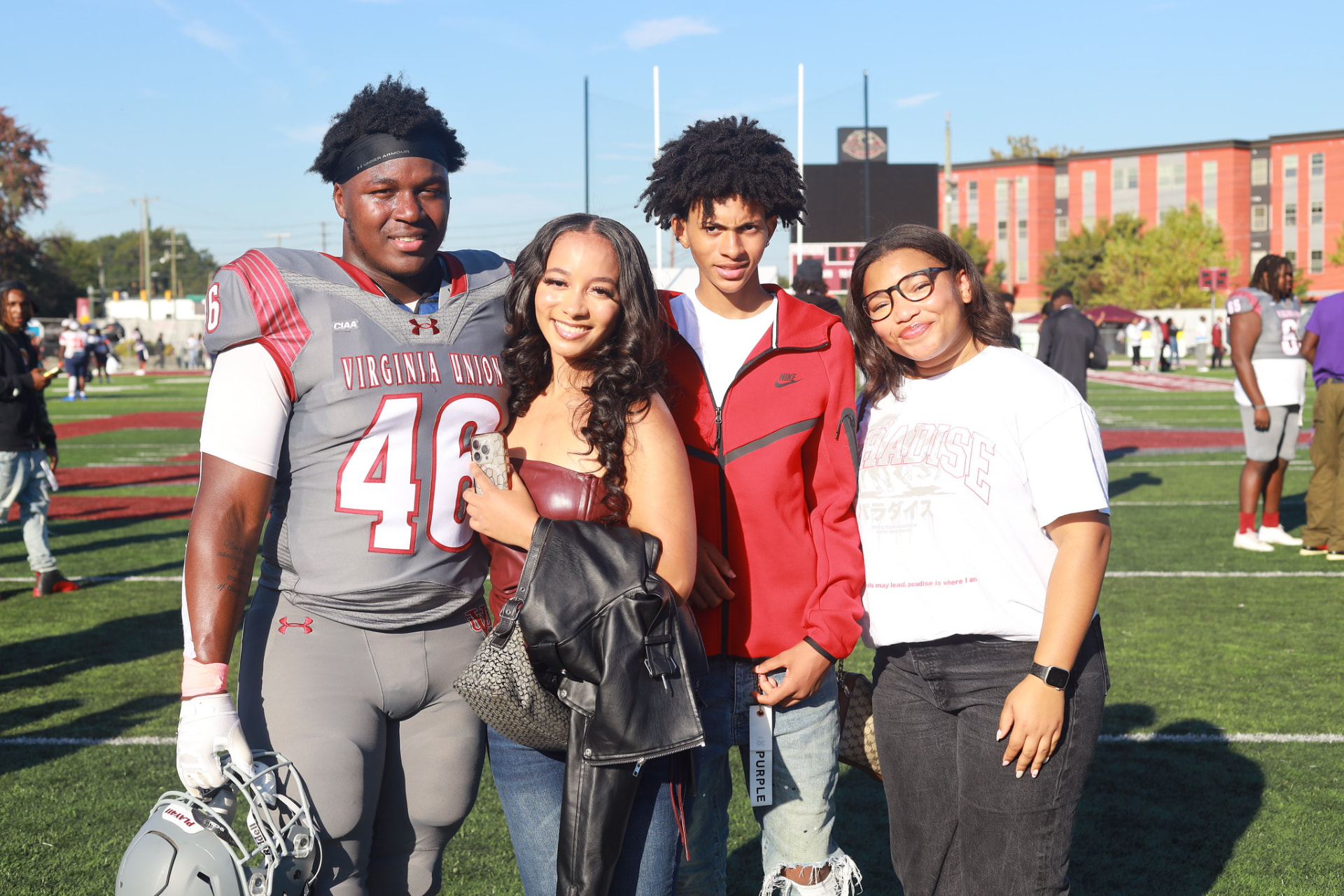 Panthers football player with family on Hovey Field